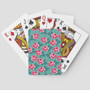 Vackra rosa rosor och prickmönster på turkos casinokort