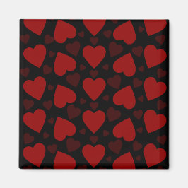 Vackrött hjärta mönster på svart magnet