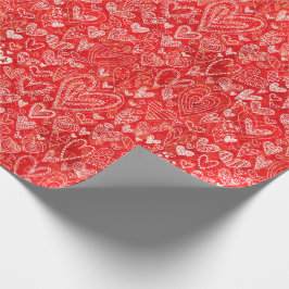 Valentin daghjärtor på rött presentpapper