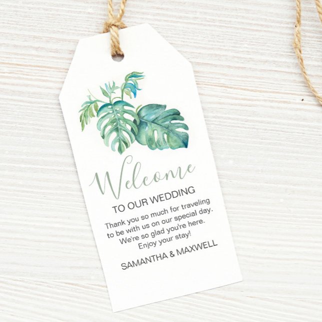 Välkomsthälsning för modern tropisk vattenfärg presentetikett (Tropical destination wedding theme monstera palm leaf watercolor art by Victoria Grigaliunas)