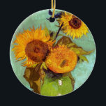 Van Gogh - tre solblommor i A Vas - fin konst Julgransprydnad Keramik<br><div class="desc">Olja på arbetsyta från 1888 som visar ljusa solblommor av gult i grönt vas mot en turkblå bakgrund. Till skillnad från liknande butiker har Art Älskare Cafe klassiska konstverk med hög upplösning som har återställts omsorgsfullt, balanserat och retuscherat i färg för att ta bort fläckar och artefakter som är vanliga...</div>