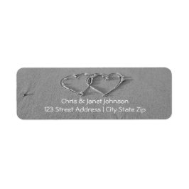 Vända hjärtan i sandreturetiketter returadress etikett