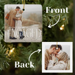 Vår första julmålade överlägg 2-foto julgransprydnad keramik<br><div class="desc">Fira denna speciella milstolpe med vår "Vår första julklapp - Överlägg 2 fotokeramiska prydnadsföremål". Den har en elegant vit, modern manusöverlägg som lyder "Vår första julfest". Den tidlösa designen skapar en vacker keepy för att hedra minnet av din förlovning. Anpassa ornamenten genom att lägga till namn och förlovningens år. Den...</div>