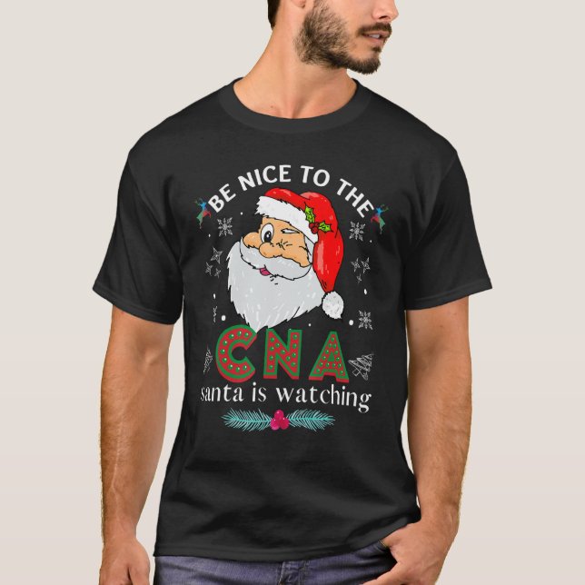 Var snäll mot Cna Nurse Santa som tittar på matchn T Shirt (Framsida)