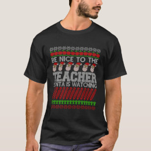 Var snäll mot lärartomten som tittar på Julafton T Shirt