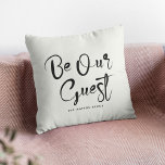 Var vår moderna Snyggt för gästtextfamiljen Anpass Kudde<br><div class="desc">Gör din säng och frukost, hyra eller Airbnb till den mest kozista kvar med det här välkomnande dekorativ kudde! ✨ med en modern snyggt med "Var vår gäst" i trendigets skript är det perfekten att få gästerna att känna höger hemma. Dessutom kan du anpassa den med din familj namn eller...</div>