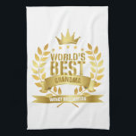 Världens bästa farmor i Guld Roligten Kökshandduk<br><div class="desc">perfektens gåva till världens bästa mormor,  mormor,  mormor,  Granny,  Nan eller Nanny.Anpassa namn för att skapa en unik gåva. Ett perfekt sätt att visa henne hur fantastisk hon är varje dag. Designad av Thisisnotme©</div>