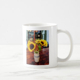 Vas av solblommor kaffemugg