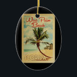 Väster Handflatan Beach Handflatan Träd Vintage re Julgransprydnad Keramik<br><div class="desc">En unik,  medeltida modern Väster Beach Florida-konst i vintage resor poster stil. Den har en böjd handflatan träd på sandstranden med hav under ett blått grumligt himlar.</div>