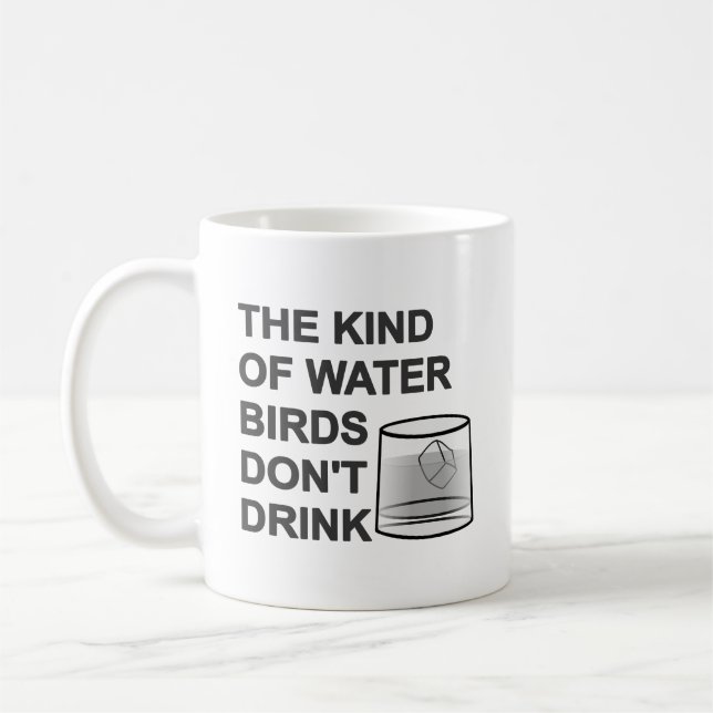 Vatten-fågeln dricker inte kaffemugg (Vänster)