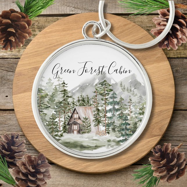 Vattenfärgskabinen i skogsområdet Grönt Gräs Rund Silverfärgad Nyckelring (Close up)