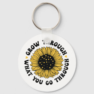 Växa genom det du går igenom nyckelring
