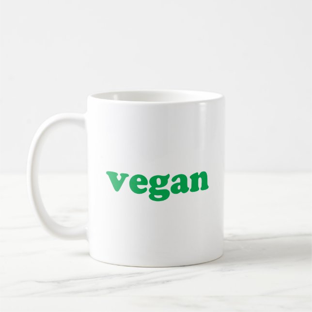 "vegan" grönt brev, vit bakgrund kaffemugg (Vänster)