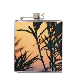 Vegetation vid solnedgång fickplunta