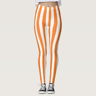 Vertikala orange- och vitrandar leggings