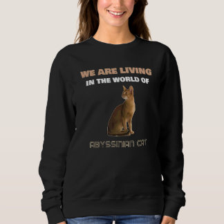 Vi lever i världen med Abyssinskt kattkatt T Shirt
