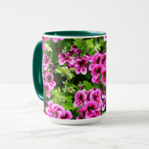 "Vibrant Blooms: Shock rosa Geraniums on Lush Bush Mugg