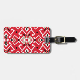Vibrant ikat mönster i rött, vitt och svart bagagebricka