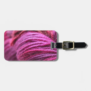 Vibrerande rosa garn bagagebricka