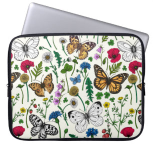 Vild blommor och fjärilar på vitt laptop fodral