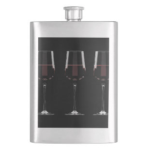 Vin-glas med rött vin på svart fickplunta