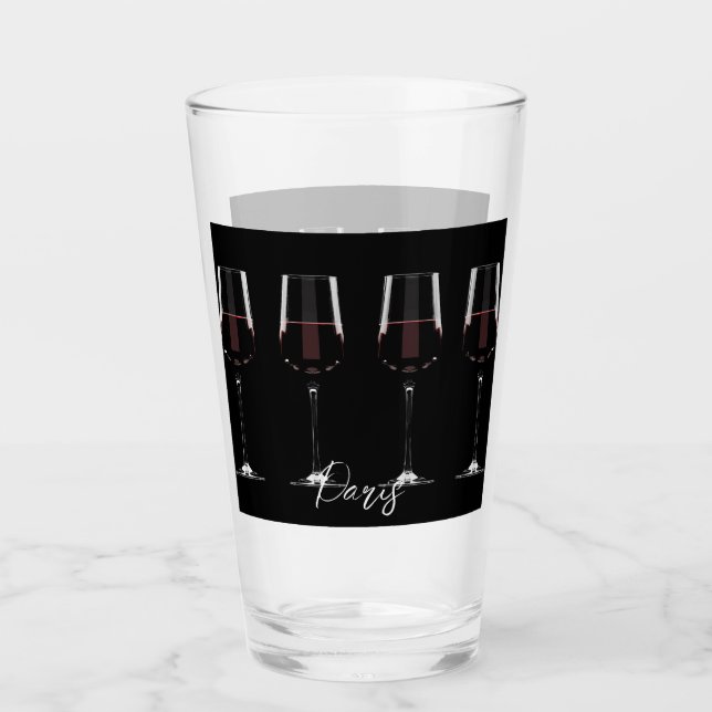 Vin-glas med rött vin på svart glaskopp (Framsida)