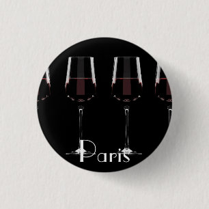 Vin-glas med rött vin på svart knapp