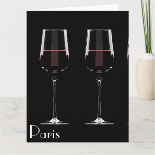 Vin-glas med rött vin på svart kort