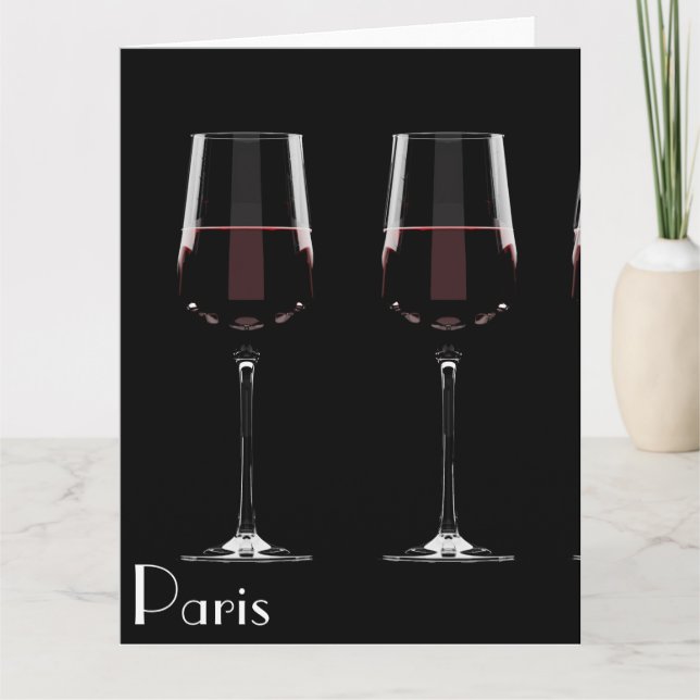 Vin-glas med rött vin på svart kort (Framsida)