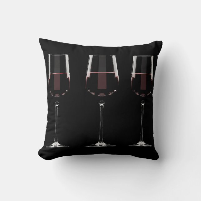 Vin-glas med rött vin på svart kudde (Framsida)
