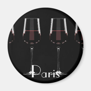 Vin-glas med rött vin på svart magnet