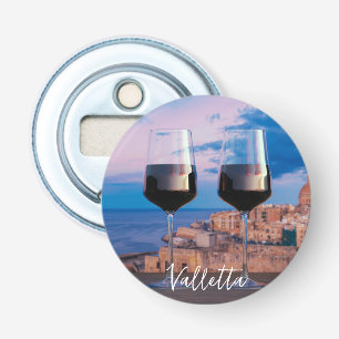 Vin-glas med tanke på solnedgången över Valletta Flasköppnare