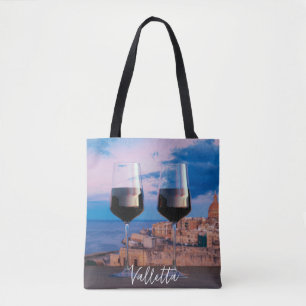 Vin-glas med tanke på solnedgången över Valletta Tygkasse