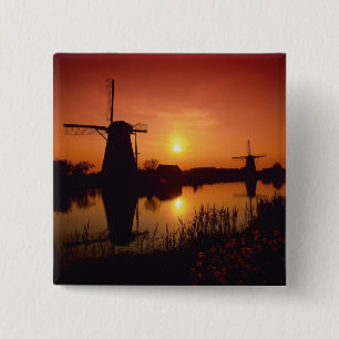 Vindkraftverk vid solnedgång, Kinderdijk, Nederlän Knapp