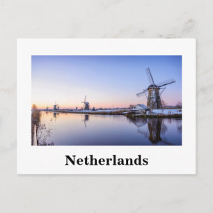 Vindkraftverk vid soluppgång i Holland vit text ko Vykort