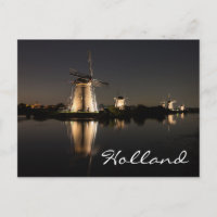 Vindkvarnar tända på natten i Hollands vykort