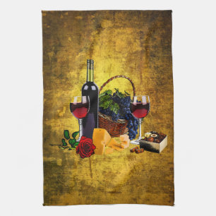 Vinexponeringsglas, flaska, druvor, ost, kökshandduk