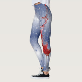 Vinexponeringsglas som plaskar rött vin på blått leggings