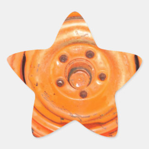 Vintage av skräppost, orange svart och vitt stjärnformat klistermärke