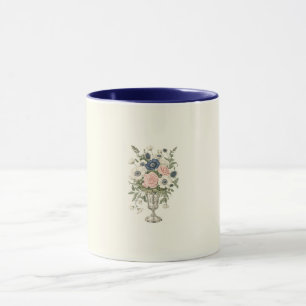 Vintage blommor i grönten av elfenbensblått rosa mugg
