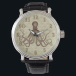 Vintage Brunt Octopus med ankare Armbandsur<br><div class="desc">Denna vackra antika bläckfisk teckning* från 1800-talet har färgats brunt och placerats på en söt ljusbrun - beige kränkt/grym bakgrund med ett blekt ankare mönster. Resultatet är en originalklocka som matchar ditt nautisk- och strandtema eller Stampunk mode. Vakuumnumren görs i ett finare, ett Victoriantypsnitt. Ögonen har gott om vätande tentakler...</div>