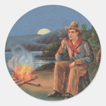Vintage cowboyen med lägereld och måne