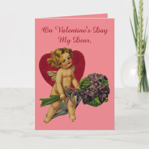 Vintage cupid med blommor helgkort
