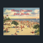 Vintage jul Florida Beach Hälsning Helg Vykort<br><div class="desc">Vintage Florida-strandscen med anpassningsbar text: god jul från Florida eller redigera till ord efter eget val. Gamla antika vykortsbilder med många människor på stranden,  handflatan träd,  en fyr och en segelbåt ger bakgrunden till en bra gammaldags Julhälsningar.</div>
