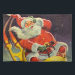 Vintage jul, Jultomten i ett rymdskepp Bordstablett<br><div class="desc">Vintage illustrerar julbilden med en helgdag som rymmer en 50-årig Jultomten som flyger ett science fiction-rymdskepp över en sömnig stad på julen Kväll.</div>