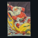 Vintage jul, Jultomten i ett rymdskepp Kökshandduk<br><div class="desc">Vintage illustrerar julbilden med en helgdag som rymmer en 50-årig Jultomten som flyger ett science fiction-rymdskepp över en sömnig stad på julen Kväll.</div>