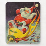 Vintage jul, Jultomten i ett rymdskepp Musmatta<br><div class="desc">Vintage illustrerar julbilden med en helgdag som rymmer en 50-årig Jultomten som flyger ett science fiction-rymdskepp över en sömnig stad på julen Kväll.</div>