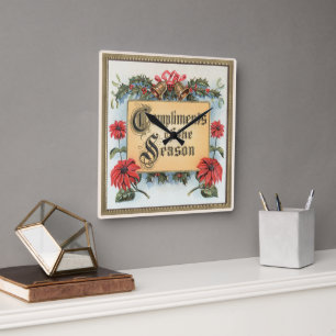 Vintage julpoinsettia i en utsmyckad ram fyrkantig klocka