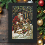 Vintage Pappa jul Ge gåvor till barn Julkort<br><div class="desc">Elegant och tidlös traditionell julkonst med leende ge julklappar till ett barn i sängen med boskap hängande i närheten och mistletokonst. Konsten förskönas med guld högdagrar och färg i bakgrunden är redigerbart. Baksidan har en unik komplementgrafik för anpassningsbarna med redigerbar fält.</div>