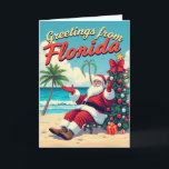 Vintage Retro Jultomten vid Beach-Florida Kort<br><div class="desc">Skicka helgdag från soliga stränder med den här Vintagen Retro Jultomten på Beach-kortet! Med en roligt, nostalgisk design av Santa som njuter av Florida kusten, ger det här kortet en varm och visuell beröring till dina julhälsningar. Perfekt för alla som kärlek retro och tropiska helgdagar är ett unikt sätt att...</div>